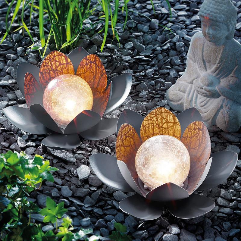 2 creative solar-powered lotus-shaped lawn lamps with metal bases and glass globes for dreamy garden lighting