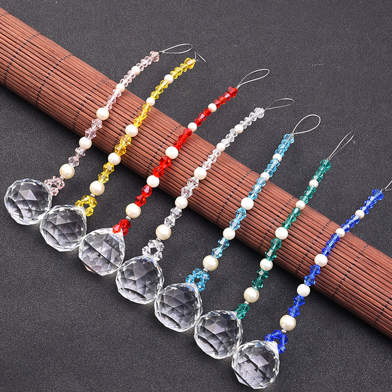 7-piece hanging chakra crystal suncatcher creates rainbow prisms for feng shui window decor