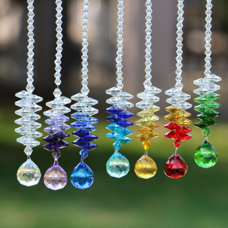 7-piece set of 30mm crystal glass chakra suncatcher prism pendants for window decoration, creating rainbows in home or wedding settings