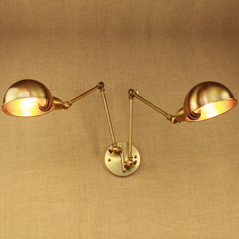 Adjustable dual-head golden wall lamp for bedroom, study, or shop decor with simple LED lighting design