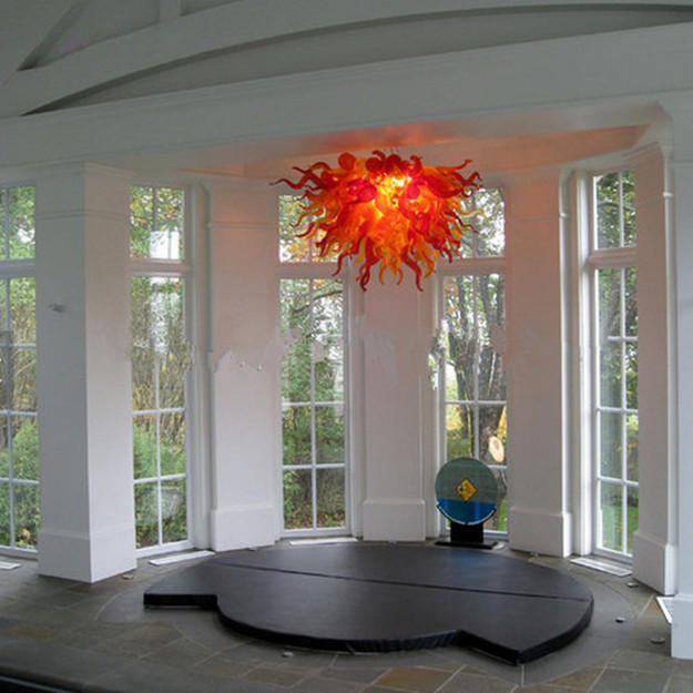 American handcrafted glass chandeliers with crystal accents, customizable for living spaces and kitchens, offering unique lighting solutions