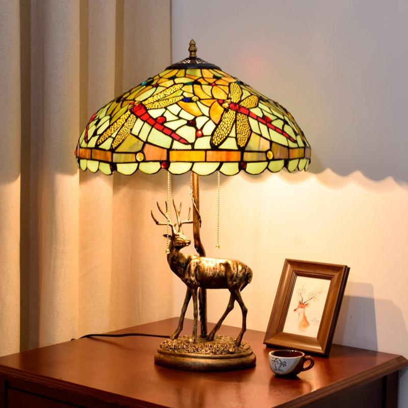 American vintage-style elk table lamp with Tiffany stained glass, perfect for bedroom, living room, or bar decor in European-inspired settings