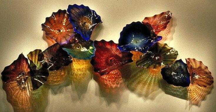 Antique hand-blown glass lamps and hanging plates featuring Murano and borosilicate artistry, perfect for wedding decor and wall art