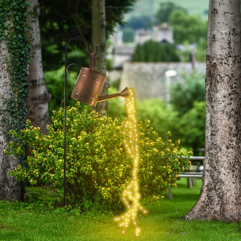 Battery-powered waterproof LED lawn lamps for garden decor, featuring fairy string lights in a watering can design for outdoor yard art