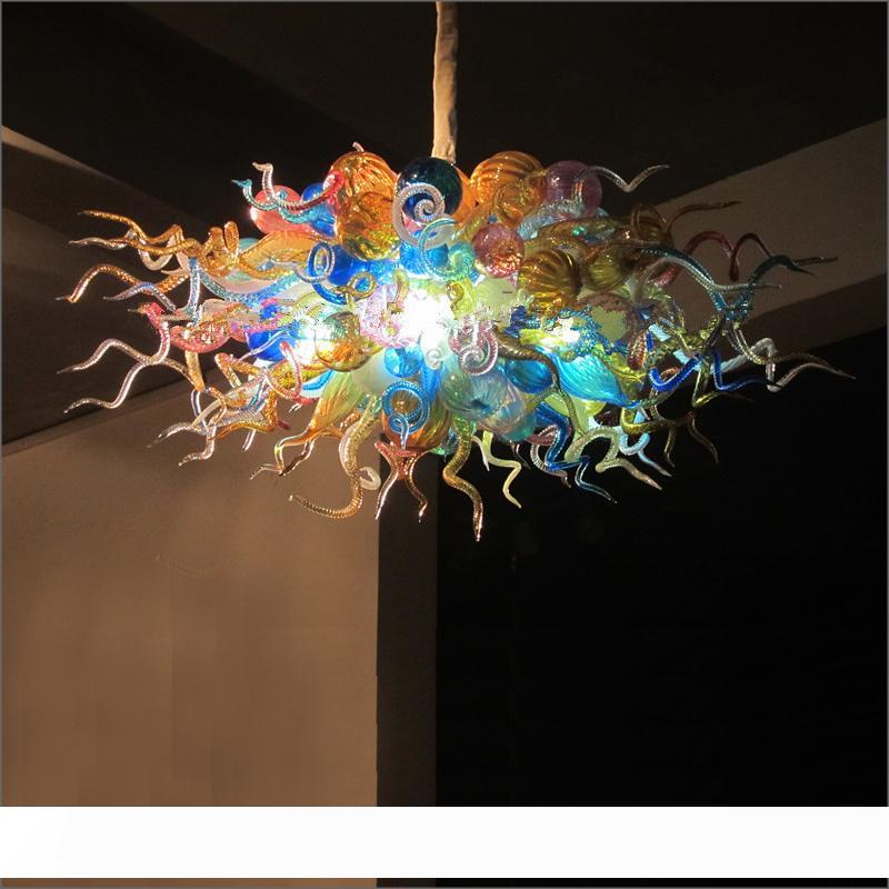 Beautiful hand-blown glass LED pendant light in amber tones for modern kitchen design