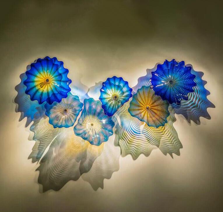 Blue contemporary handmade lighting featuring abstract Murano glass wall art lamps