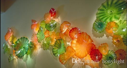 Colorful hand-blown glass flower plates for stylish wall decor