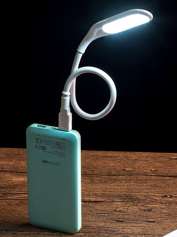 Compact USB LED book lamp with flexible neck, foldable design, portable for night use, and power bank compatibility for laptops