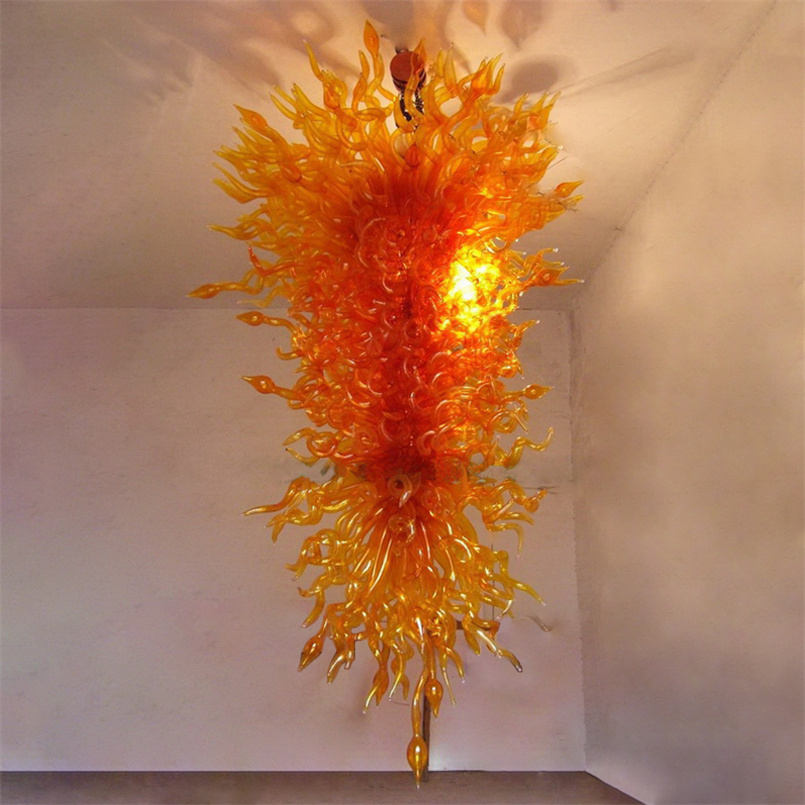 Contemporary LED pendant lights featuring amber crystal and handcrafted Murano glass chandeliers for elegant dining room decor