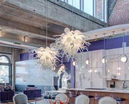 Contemporary white pendant light with hand-blown glass, ideal for cafes and hotels, featuring energy-efficient illumination