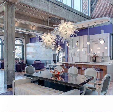 Contemporary white pendant lighting with hand-blown glass, ideal for cafes and hotels, featuring energy-efficient illumination
