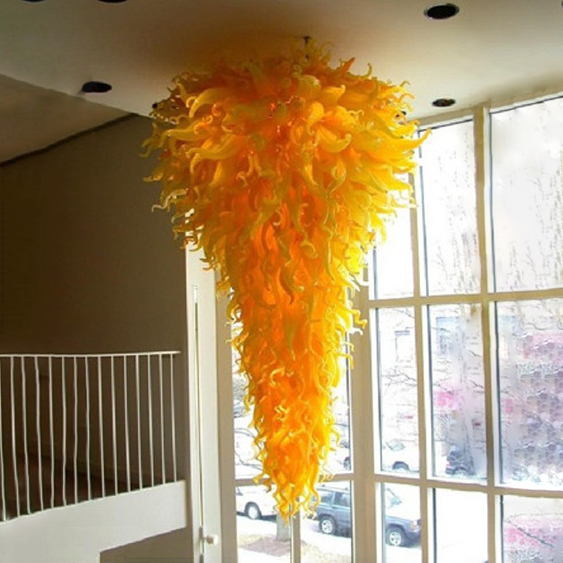 Contemporary yellow chandeliers for elegant foyers, hotels, and homes featuring handcrafted glass pendant lights with modern LED illumination