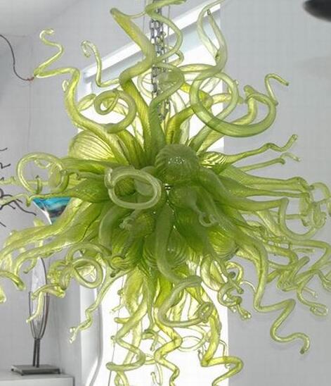 Elegant green blown glass chandeliers for wedding decor, featuring hanging chain pendants and artistic lighting