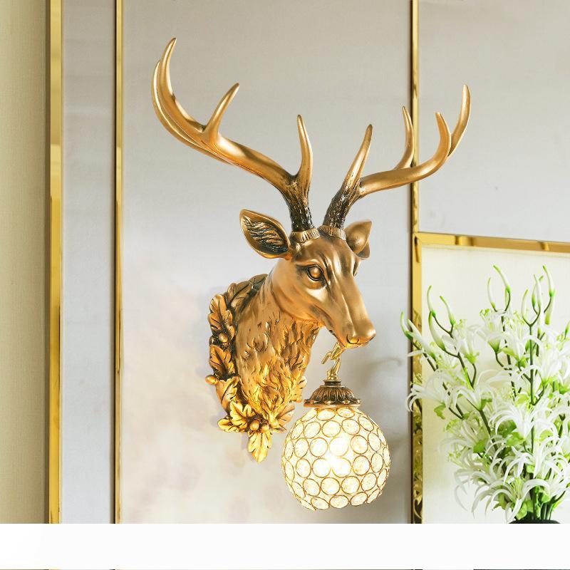 European vintage deer head wall lamp in resin for living room, bedroom, hallway, entrance, or bedside background with gold trumpet design 10042