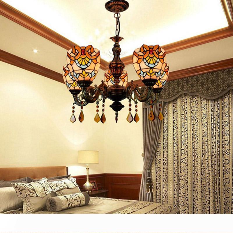 European-inspired vintage warm-toned glass Tiffany lamp for living and dining rooms with a baroque chandelier style