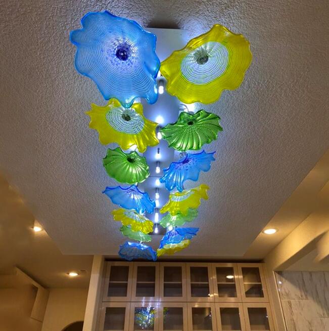 French-style mouth-blown glass chandeliers featuring large decorative floral designs for living room ceilings