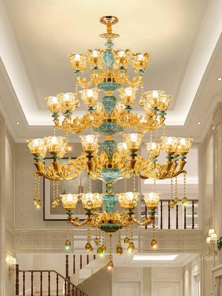 Grand duplex villa featuring a spacious living room with a three-story staircase and oversized crystal pendant chandeliers, ideal for hotels