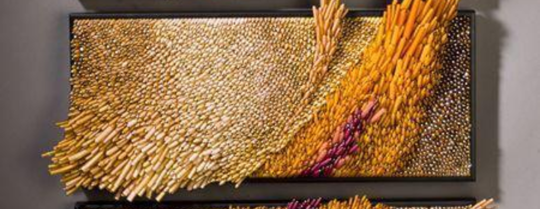 Handcrafted blown glass wall plaques featuring wind-inspired designs for decorative art