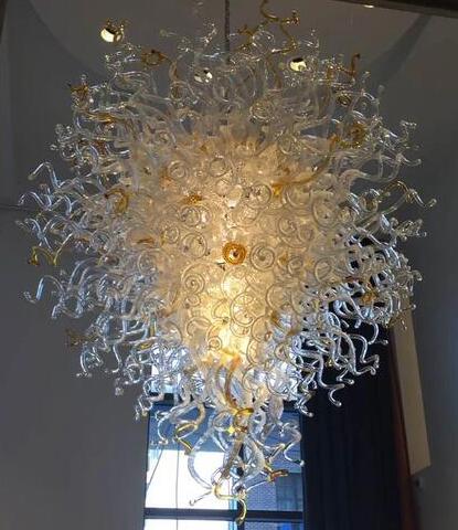 Handcrafted large blown glass chandeliers and pendant lights for elegant hotel decor and artistic spaces