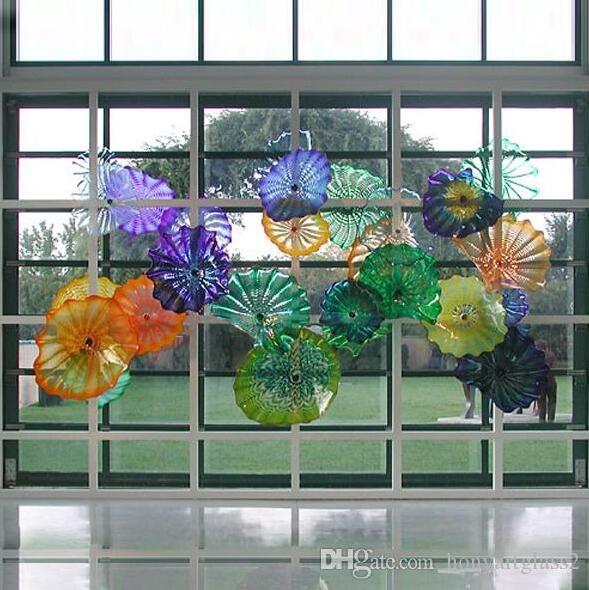 Handcrafted Murano glass art plates in Mediterranean style, perfect for wall decor in hotels, homes, and bars