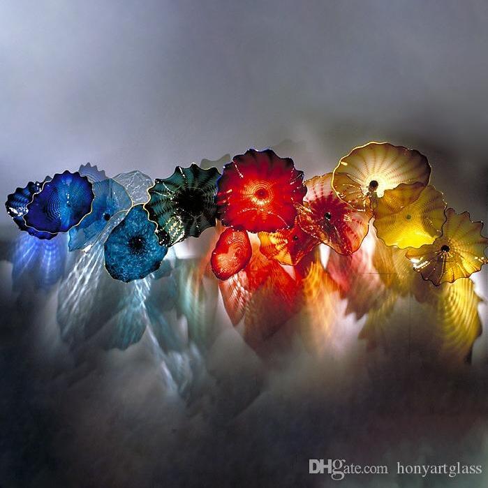Handcrafted Murano glass wall lamp with vibrant yellow and blue hues, ideal for enhancing hotel, villa, or fireplace decor