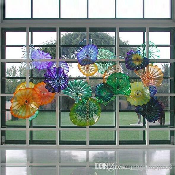Handcrafted Murano-style glass wall plates for elegant Mediterranean decor in hotels, homes, and bars
