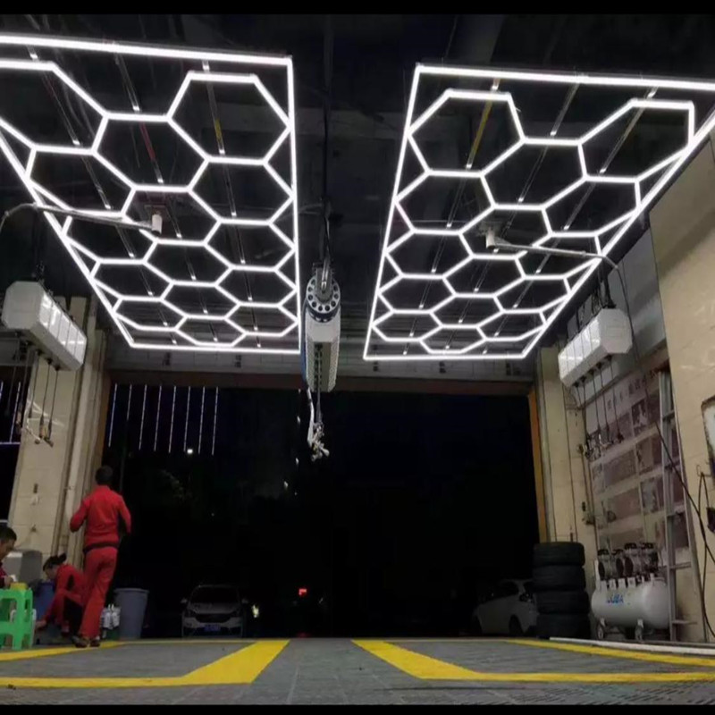Honeycomb LED garage lighting with customizable hexagon design for car showrooms and detailing shops