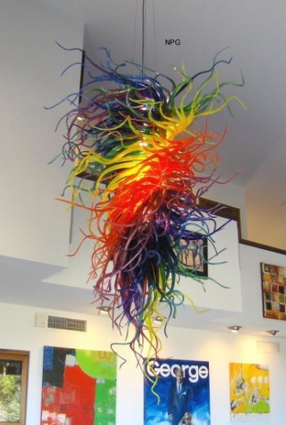 Hotel lobby decor featuring rainbow art Murano glass chandelier-style LED lights and hand-blown glass pendant lamps