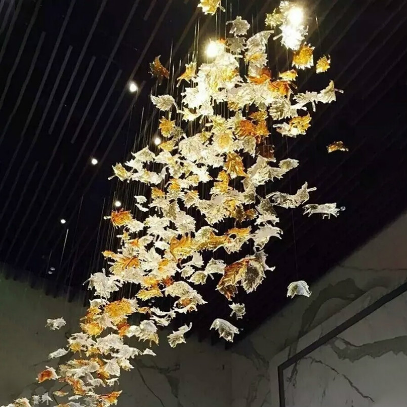 Hotel Maple Leaf's elegant chandelier features handcrafted blown glass pendant lights, perfect for modern hotel decor and custom lighting projects