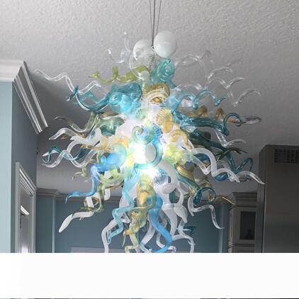 Hotel Villa Nordic's dining room features a handcrafted glass chandelier with LED lighting and vibrant multicolored floral designs