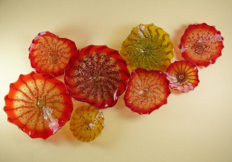 Italian-inspired orange wall lamps with modern Murano glass floral designs for stylish home decor