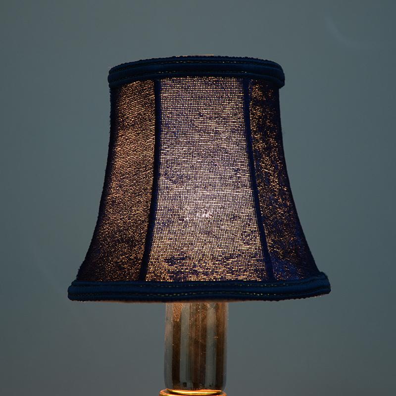 Lamp covers and shades made from shade cloth fabric, perfect for decorating homes and fitting wall candles or chandeliers