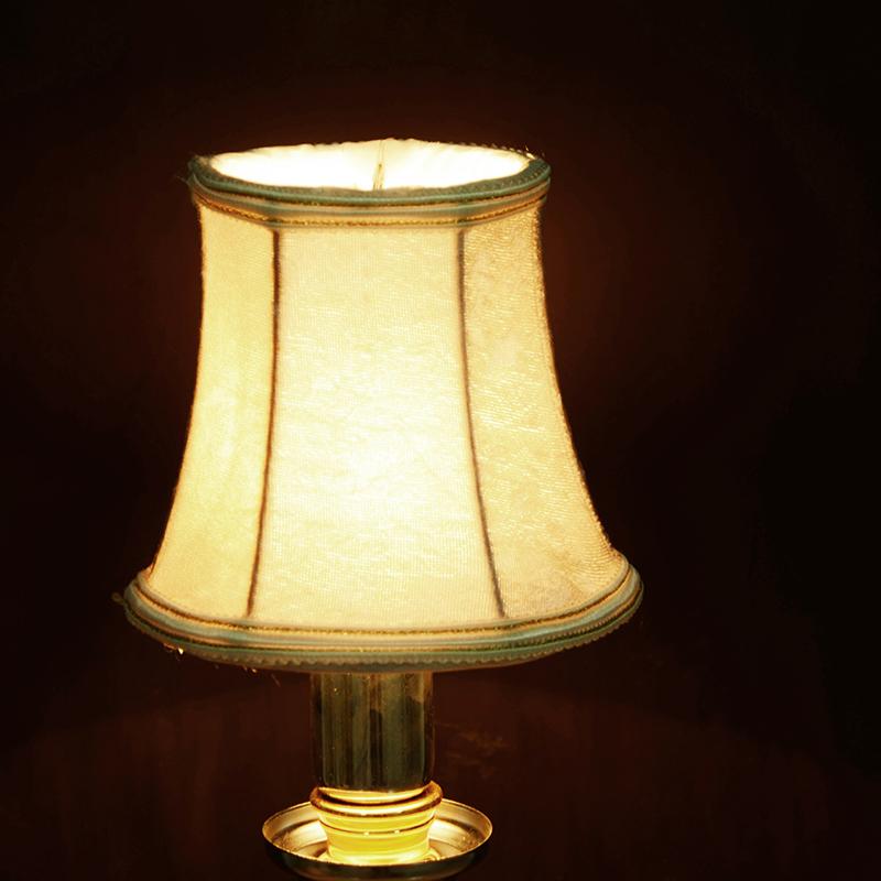 Lamp covers and shades made from shade cloth fabric, perfect for decorating homes and complementing wall candles or chandeliers