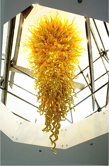 Lamps Lobby's decorative long chain chandeliers feature energy-saving LED lights with large blown glass crystals for modern high ceilings
