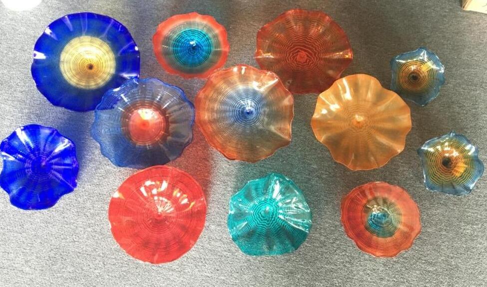 Latest multicolored Murano glass lamps featuring floral designs, ideal as hanging plates or wall decor for homes and hotels