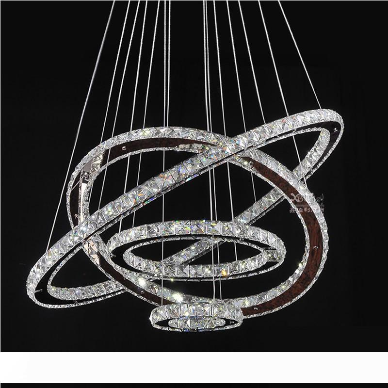 LED Chandeliers Crystal Round Rings Lighting Fixtures Modern Silver Dinning Room Hanging Lamps DIY Style Tri-tone light

Modern silver dining room LED chandeliers with crystal round rings and tri-tone lighting in DIY style