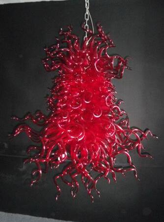 Luxurious crystal chandeliers for weddings featuring long, oversized ceiling lights in vibrant red hues, crafted from hand-blown Murano glass