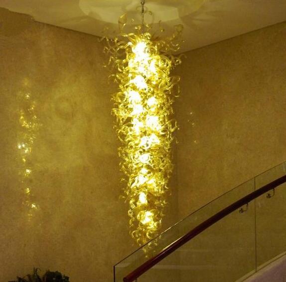 Luxury floral-inspired oversized amber LED chandelier with handcrafted glass for elegant hotel lobby lighting