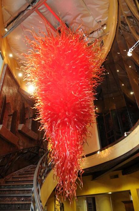 Luxury red chandelier featuring hand-blown glass, ideal for weddings and contemporary decor