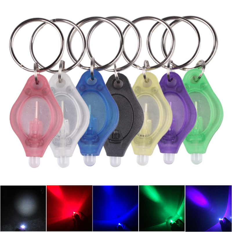 Mini LED keychain flashlight with white and UV lights for dark environments, ideal for camping, hiking, and hunting