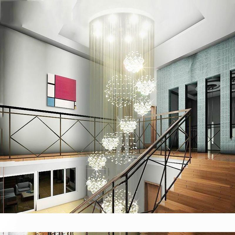 Modern chandelier featuring large crystal spheres and 13 GU10 bulbs for flush ceiling installation