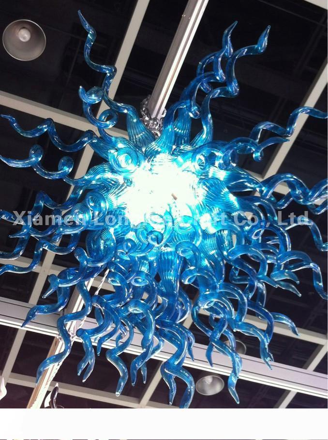 Modern glass chandelier with elegant blue crystal accents, a stylish yet affordable hanging light fixture