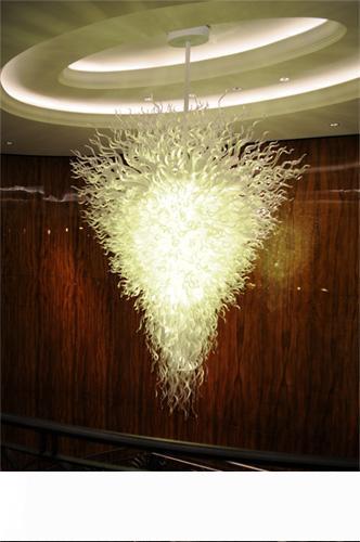 Modern Italian-inspired LED villa lighting with custom art designs, featuring elegant glass chandeliers and crystal accents for home decor