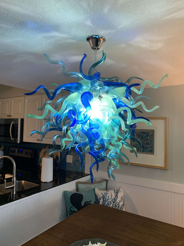 Modern kitchen lighting with Murano blue and aqua green glass chandeliers featuring hand-blown Venetian pendants and LED spiral staircase hanging lights