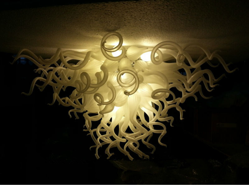 Modern LED ceiling lights from Lamps Country featuring energy-efficient illumination and elegant white glass design for stylish living room decor