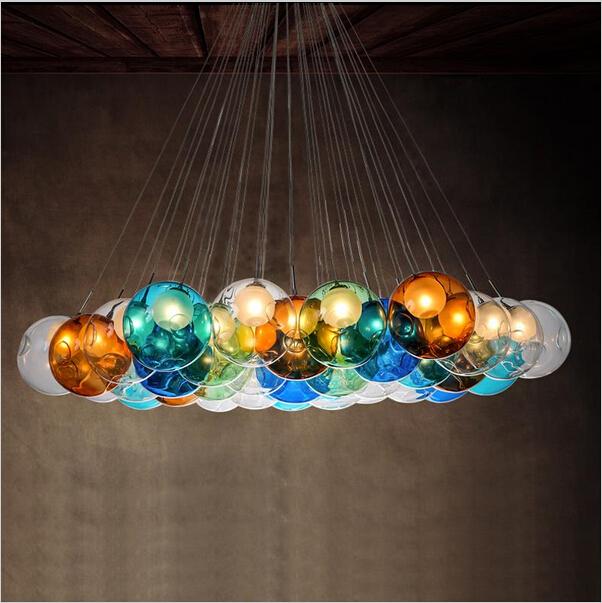 Modern LED glass chandeliers featuring colorful pendant lighting for dining rooms, living spaces, and bars