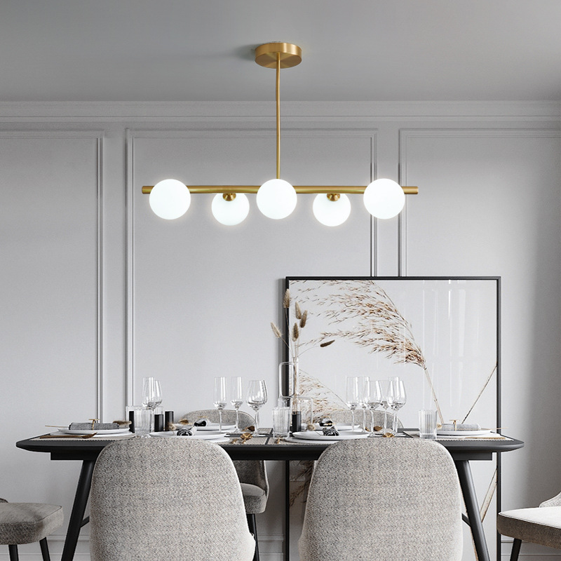Modern LED pendant lamp featuring a sleek glass ball design, perfect for Nordic-style living rooms, bedrooms, and kitchens