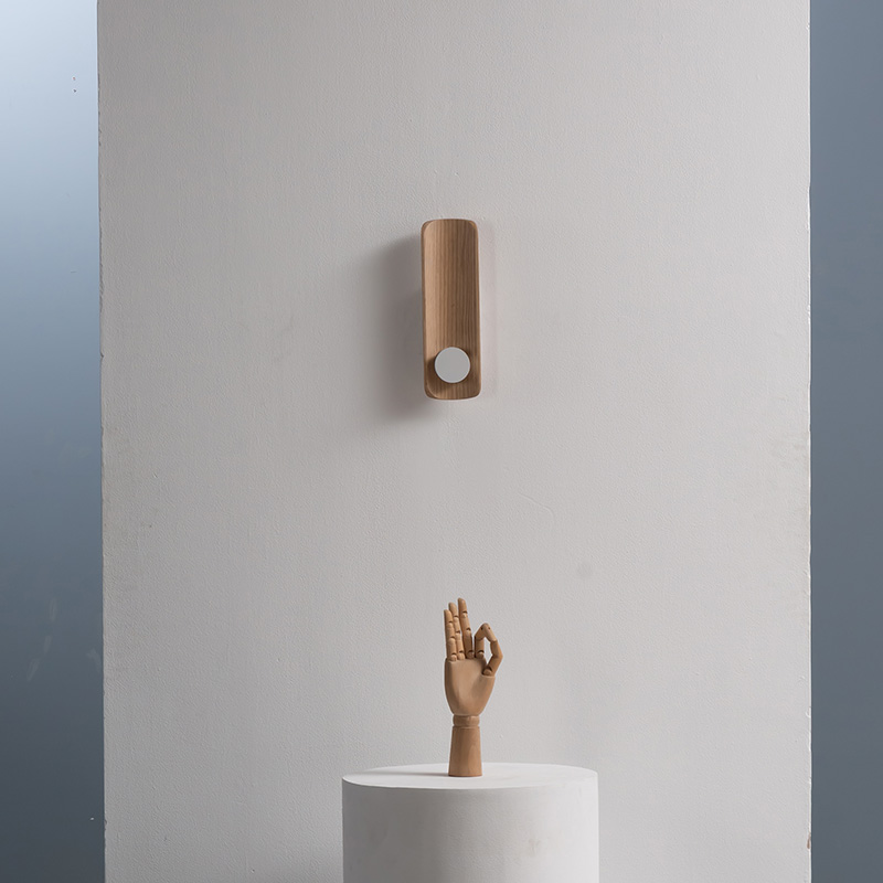 Modern LED wall sconce with wood-textured finish