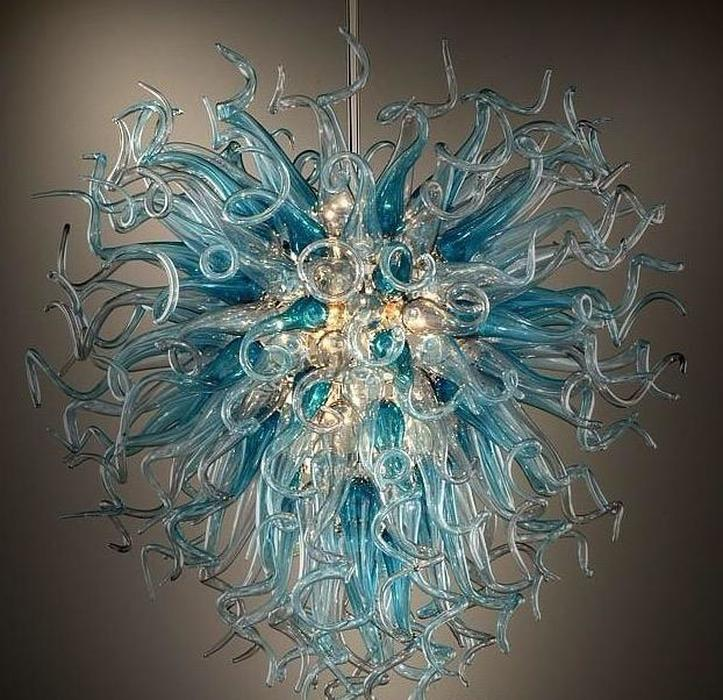 Modern stylish lighting for hotel lobbies and museums featuring crystal chandeliers with LED lights and Tiffany stained glass designs