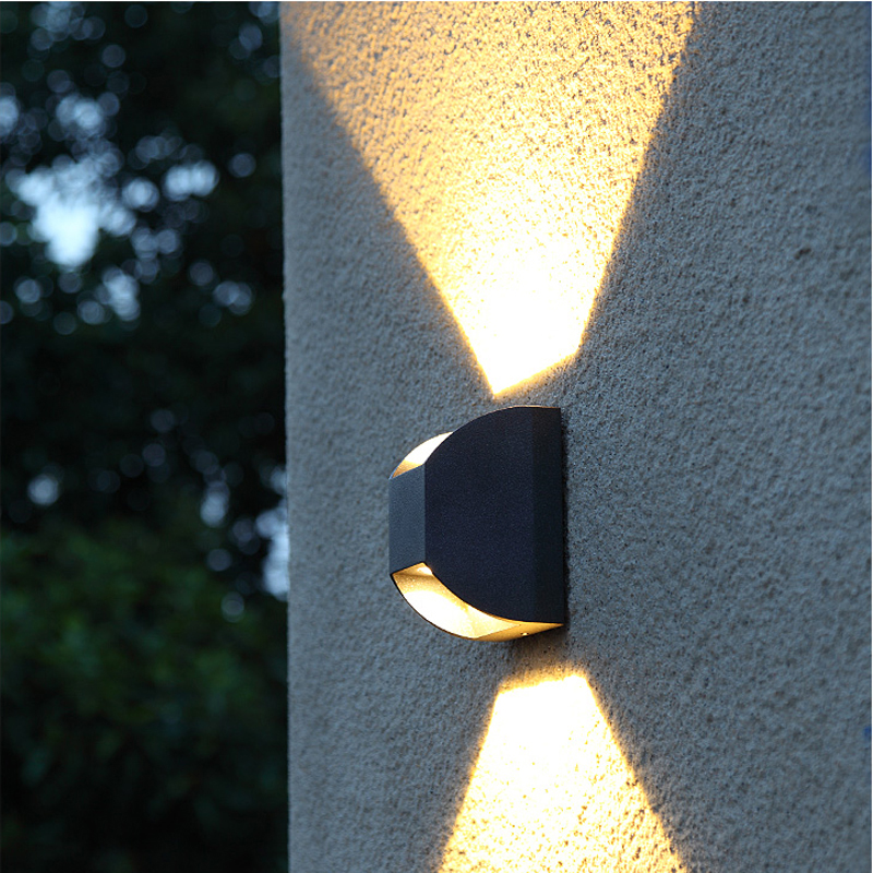 Modern waterproof LED outdoor wall light with up-down illumination for patios and porches